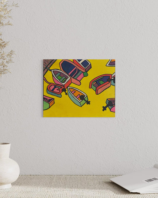 “Harbor Pop” by Andrew French displayed above a minimalist console with soft neutral décor, highlighting the painting’s bright yellow tones and playful nautical design.