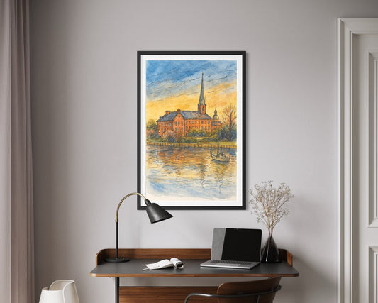 A framed artwork showcased above a modern writing desk with a laptop and reading lamp. Neutral tones and soft textures create a calm, stylish home office look.