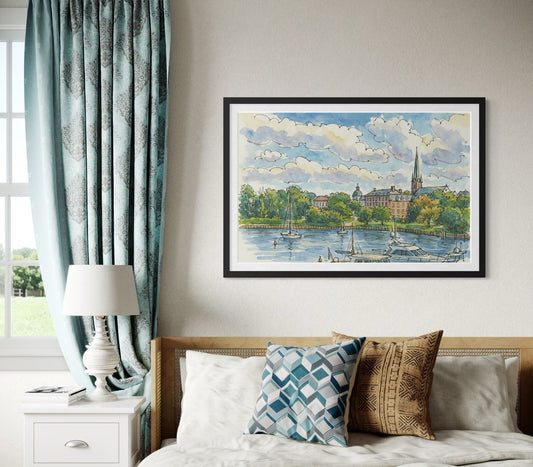 A framed artwork displayed above a bed in a cozy bedroom with soft blue curtains and textured pillows. Natural light highlights the artwork as the centerpiece of the space.