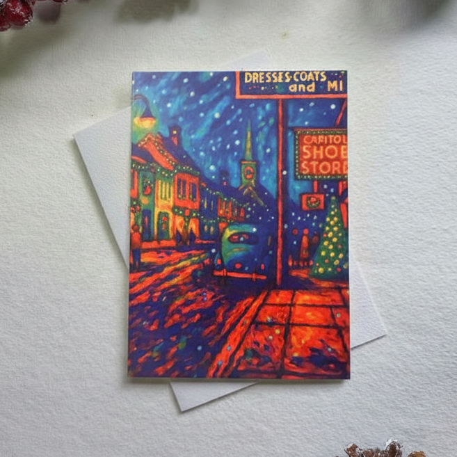 Colorful card with a cityscape design on a white surface with decorative elements.