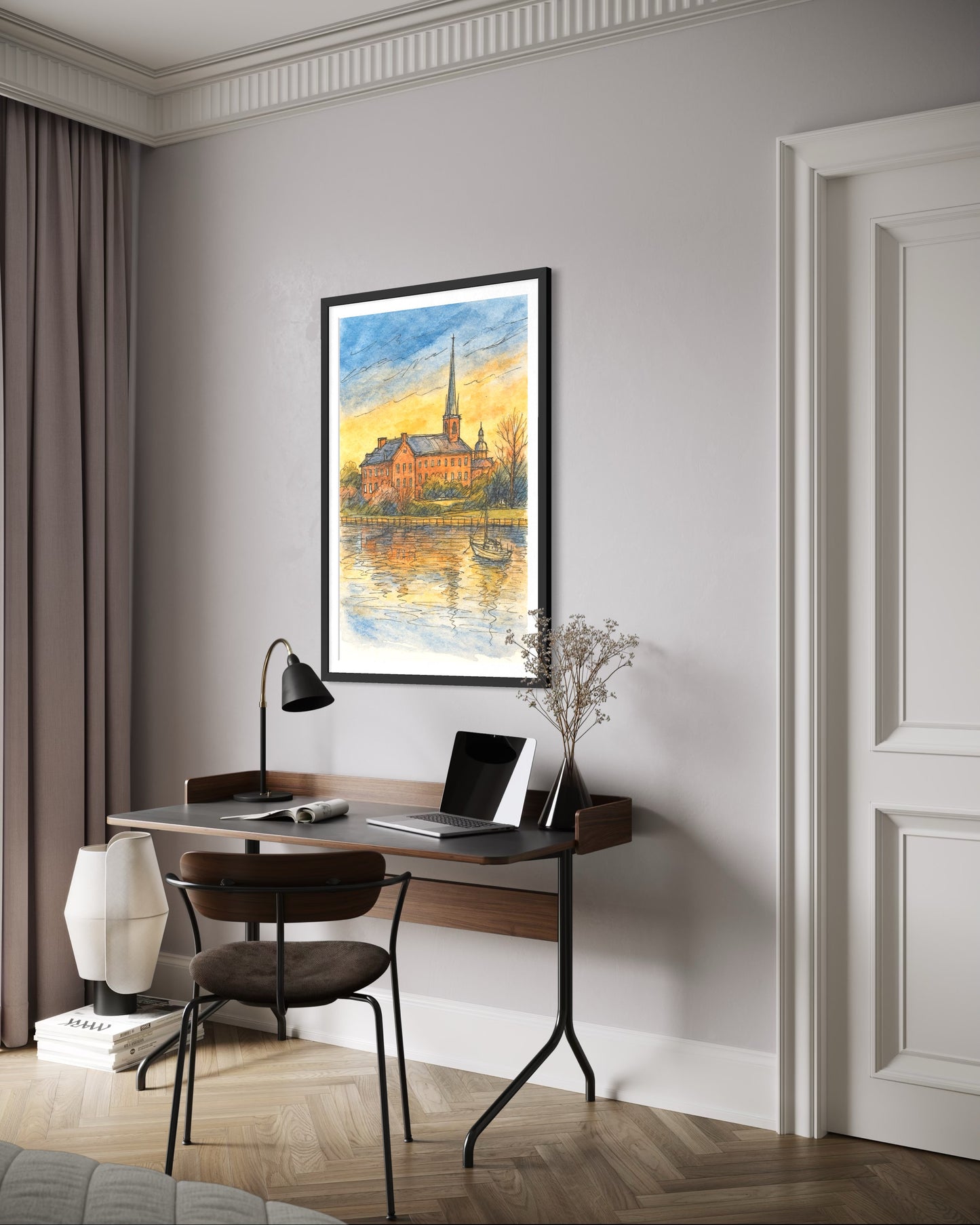 A framed artwork showcased above a modern writing desk with a laptop and reading lamp. Neutral tones and soft textures create a calm, stylish home office look.