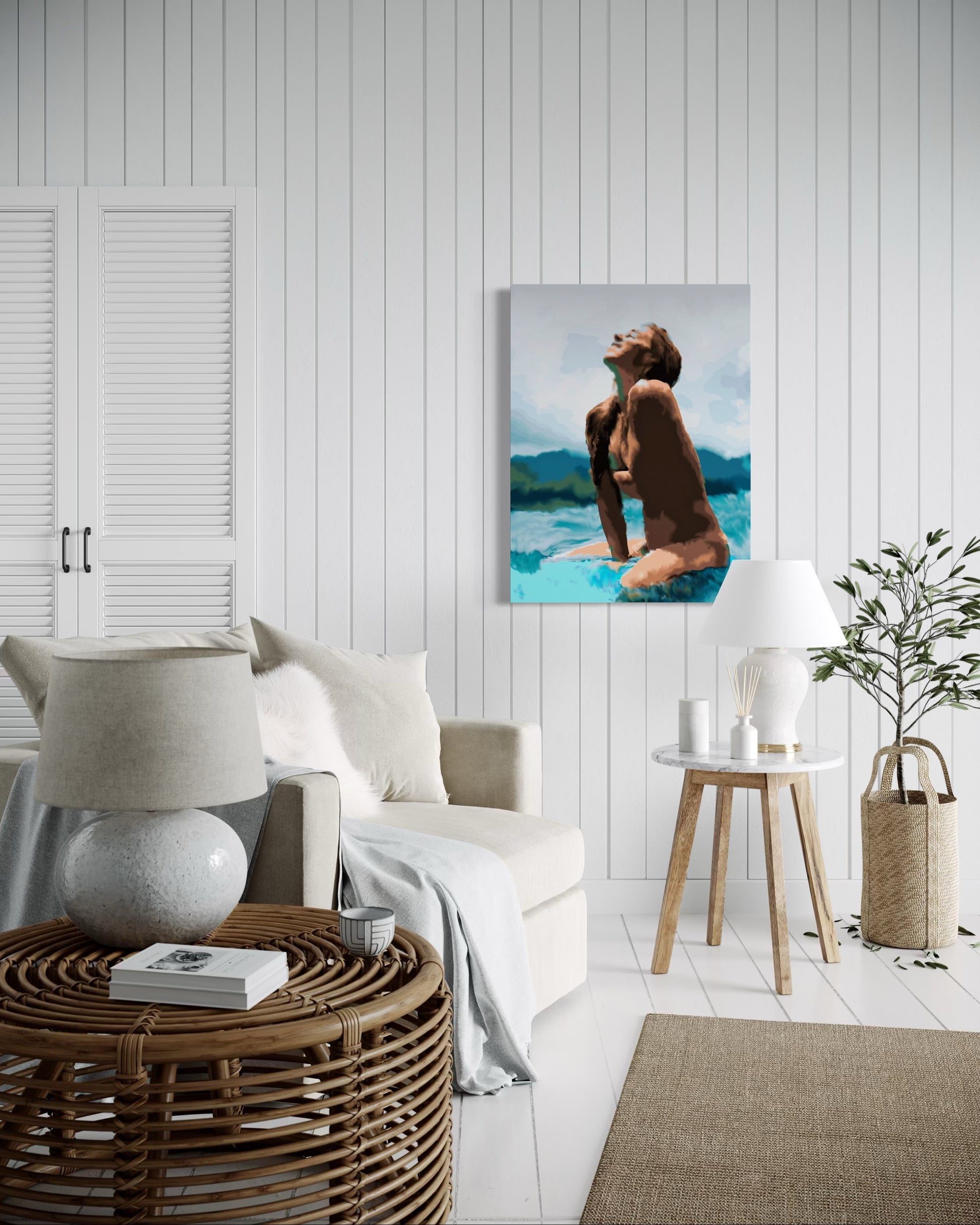 “Surfer Girl” by Andrew French displayed in a cozy coastal-style living room with white paneled walls, rattan furniture, and soft neutral décor, adding a serene ocean-inspired accent to the space.