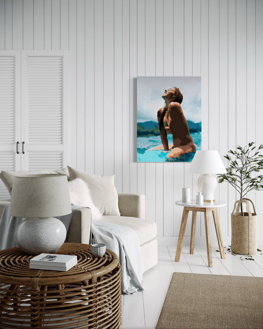“Surfer Girl” by Andrew French displayed in a cozy coastal-style living room with white paneled walls, rattan furniture, and soft neutral décor, adding a serene ocean-inspired accent to the space.