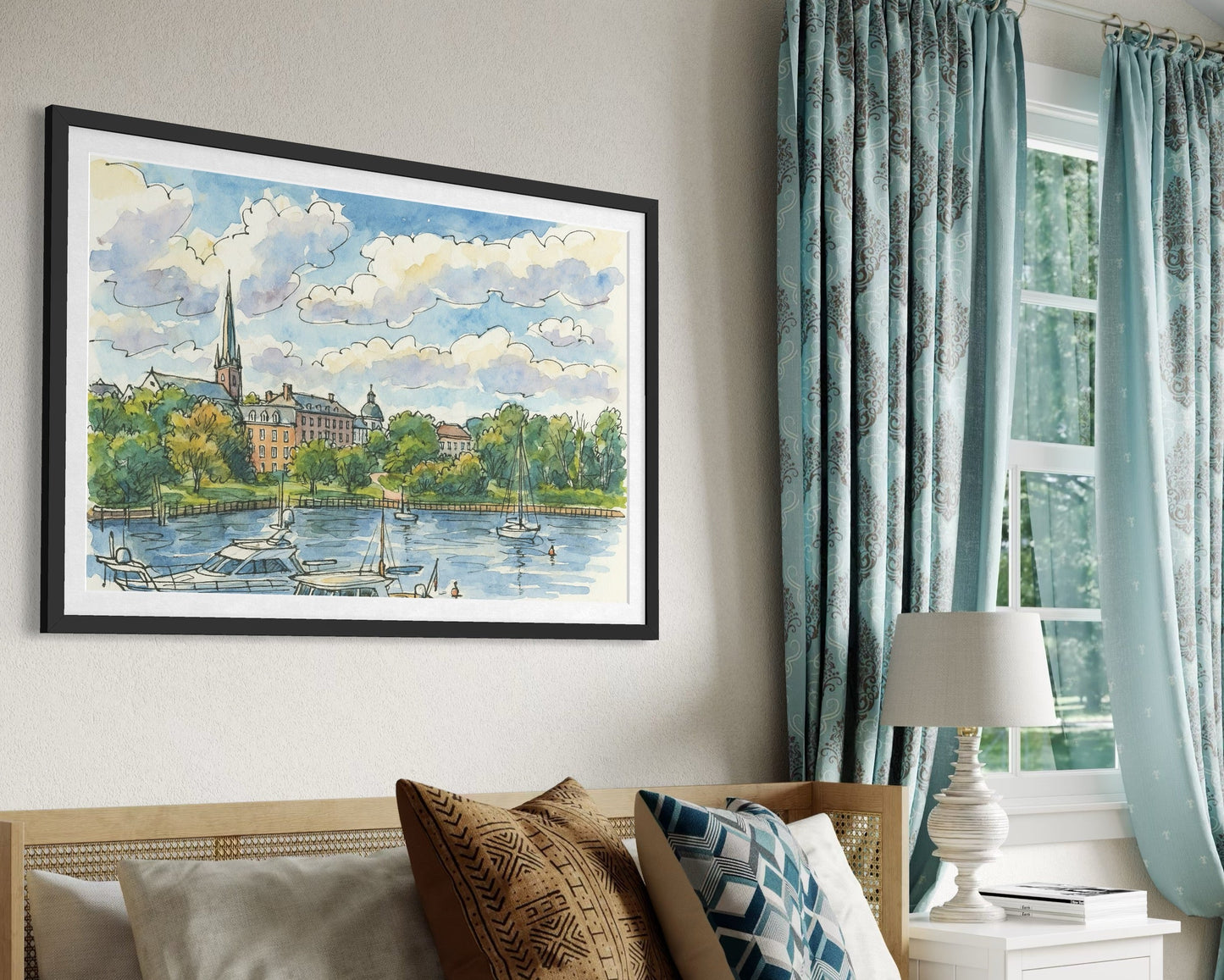 A framed artwork displayed above a bed in a cozy bedroom with soft blue curtains and textured pillows. Natural light highlights the artwork as the centerpiece of the space.